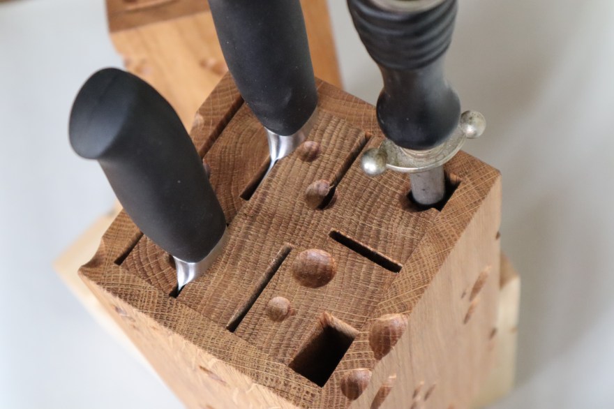 1 wooden knife block cut like emmentaler cheese