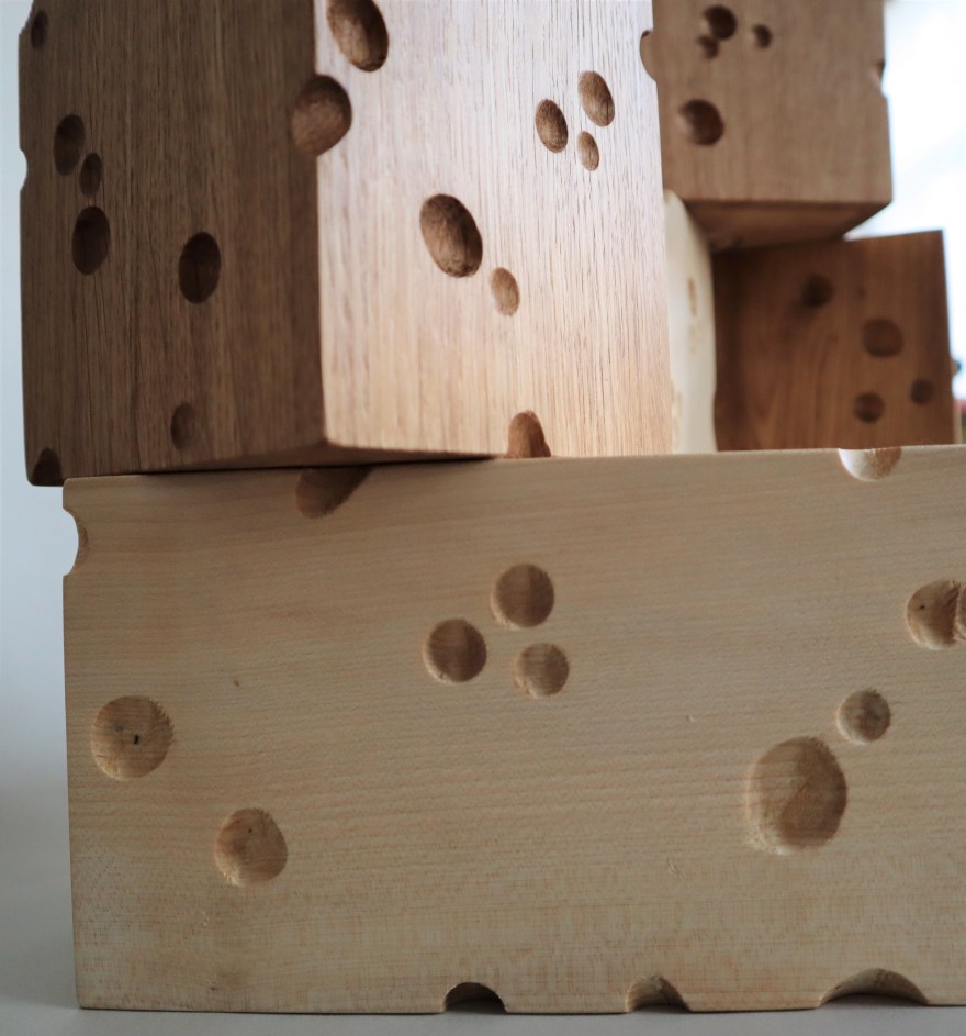 5 wooden knife blocks cut like emmentaler cheese