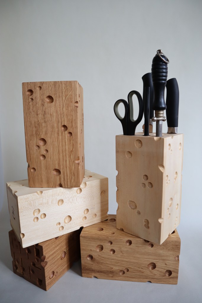 5 wooden knife blocks cut like emmentaler cheese